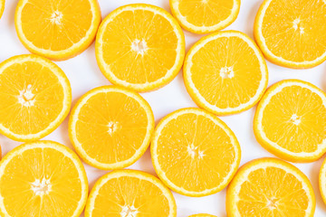 Fresh bright round orange slices. Shades of orange. Flat lay, top view, bright design. Fruit composition. Concept of vitamin C, healthy wholesome food.