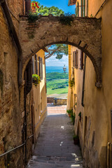 Narrow street in Montepulciano, a town in the province of Siena, in the Val d'Orcia in Tuscany, Italy, Europe.