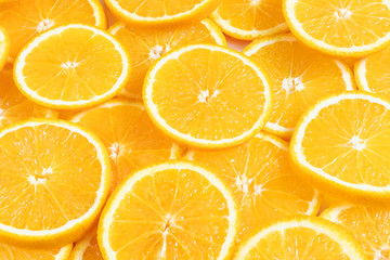 Fresh bright round orange slices. Shades of orange. Flat lay, top view, bright design. Fruit composition. Concept of vitamin C, healthy wholesome food.