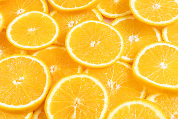 Fresh bright round orange slices. Shades of orange. Flat lay, top view, bright design. Fruit composition. Concept of vitamin C, healthy wholesome food.