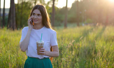A young girl with a coffee cocktail. Summer image.