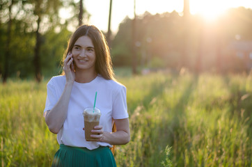 A young girl with a coffee cocktail. Summer image.