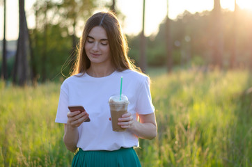 A young girl with a coffee cocktail. Summer image.