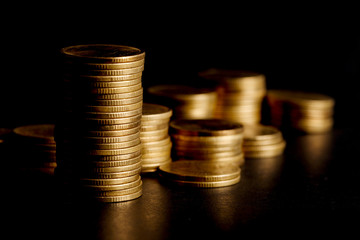 Stack of Gold Coin on Black Background.