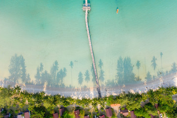 Aerial view. Beautiful tropical beach and wooden bridge in the sea in island Koh Kood Thailand