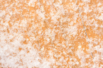 Snowy brown wooden background