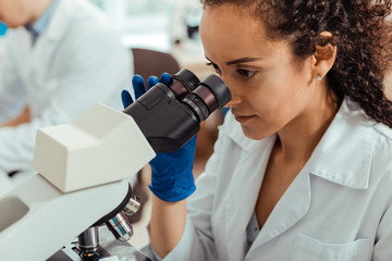 Face of a smart young female biologist