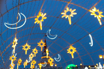 Christmas illumination on downtown street.