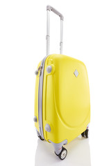 yellow wheeled colorful suitcase with handle isolated on white