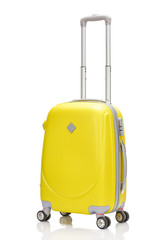 yellow plastic wheeled suitcase with handle isolated on white