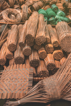 Materials and equipment of thai OTOP product from dry Catathea grass weave as basketry.