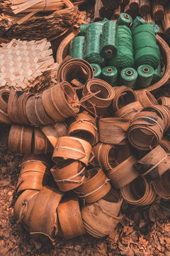 Materials and equipment of thai OTOP product from dry Catathea grass weave as basketry.