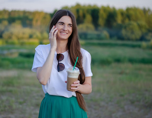 A young girl with a coffee cocktail. Summer image.