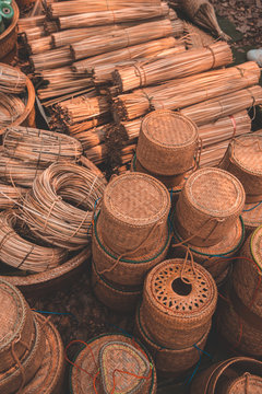 Materials and equipment of thai OTOP product from dry Catathea grass weave as basketry.