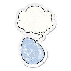 cartoon egg and thought bubble as a distressed worn sticker