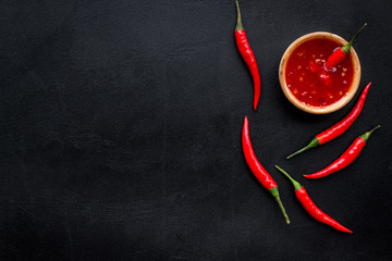 Fresh red chilli pepper as food ingredient on dark table background top view mockup