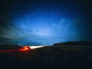 beautiful night landscape with car and stars