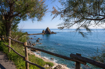 View of the rock with the cross in the village of Riva Trigoso, ligurian riviera, Genoa province, Italy