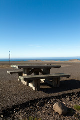 Wooden bench and table on a beautiful multicolored spring landscape of Iceland