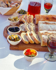 Various spiced ciabatta breads on cutting board