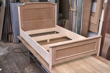 Bed building process. Wooden furniture manufacturing process. Furniture manufacture.