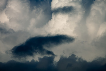 Blue sky with white cumulus clouds. Toned