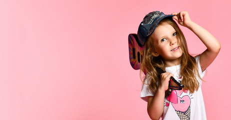 portrait of young girl with a guitar on the stage