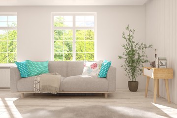 Stylish room in white color with sofa and summer landscape in window. Scandinavian interior design. 3D illustration