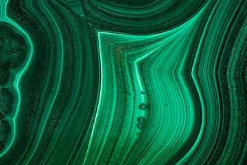 The green malachite. An ornamental stone. Photo texture. Macro.
