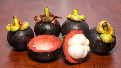 Tropical fruits mangosteen on the wooden table