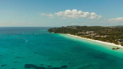 Fototapeta premium Tropical beach with tourists and clear blue sea, top view. Summer and travel vacation concept. Boracay, Philippines