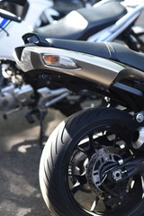 A motorbike on the show with chrome details and other parts, closeup with depth of field openair