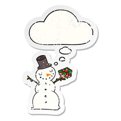 cartoon snowman and thought bubble as a distressed worn sticker