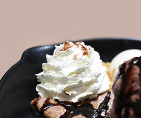 ice cream on the waffle and wipping cream