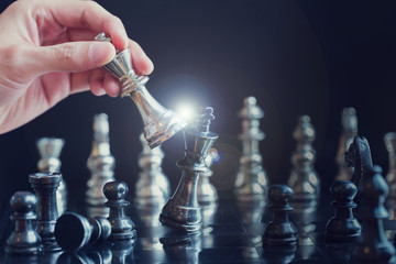 King and Knight of chess setup on dark background . Leader and teamwork concept for success.