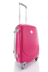 bright red wheeled colorful suitcase with handle isolated on white