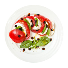 top view mozzarella and tomato with basil leaves