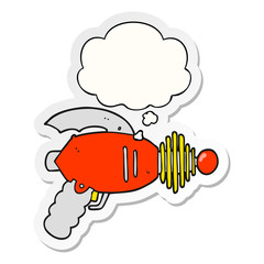 cartoon ray gun and thought bubble as a printed sticker