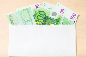 fan from many one hundred euro notes in envelope
