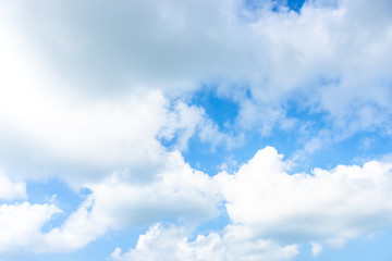 Nature Bright blue Sky with white clouds on blackground. Beautiful sky and clouds in the afternoon.