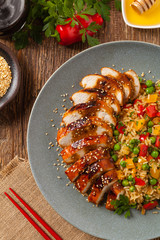 Grilled chicken breast in teriyaki sauce. Served with brown rice and vegetables.