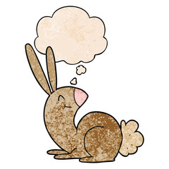 cute cartoon rabbit and thought bubble in grunge texture pattern style