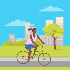Afro-american woman riding on bike in city park with trees, bushes and buildings. Vector teenage girl at bicycle, cartoon character female ride on cycle