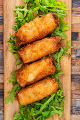 4 pork spring rolls Rice cakes stuffed with a pork stuffing accompanied by sauce