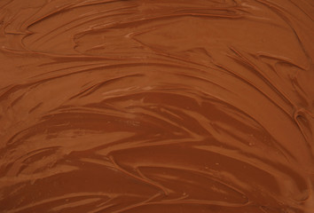 Chocolate spread as background, melted chocolate pattern