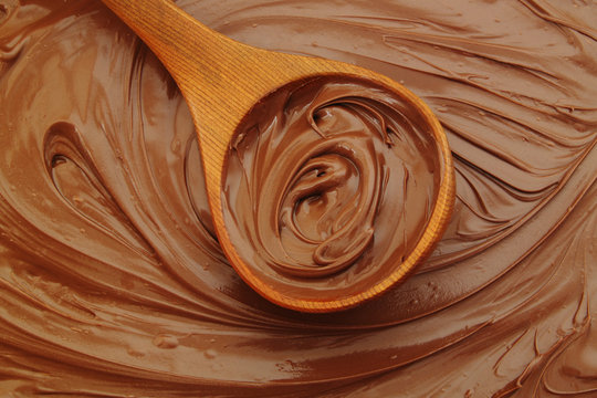 Chocolate spread with wooden spoon