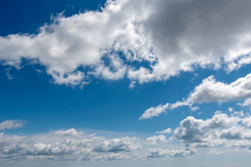 white clouds in bright blue sky