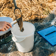 Soil Sampling. Agronomist Taking Sample With Soil Probe Sampler