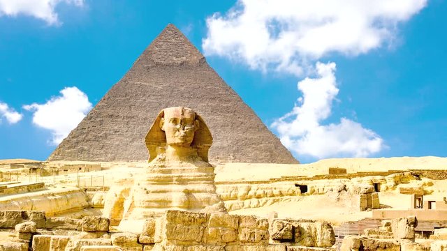 Timelapse of the famous Sphinx with great pyramids in Giza valley, Cairo, Egypt
