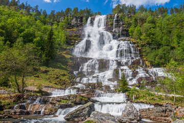 Tvindefossen waterfall in summer season, Norway.